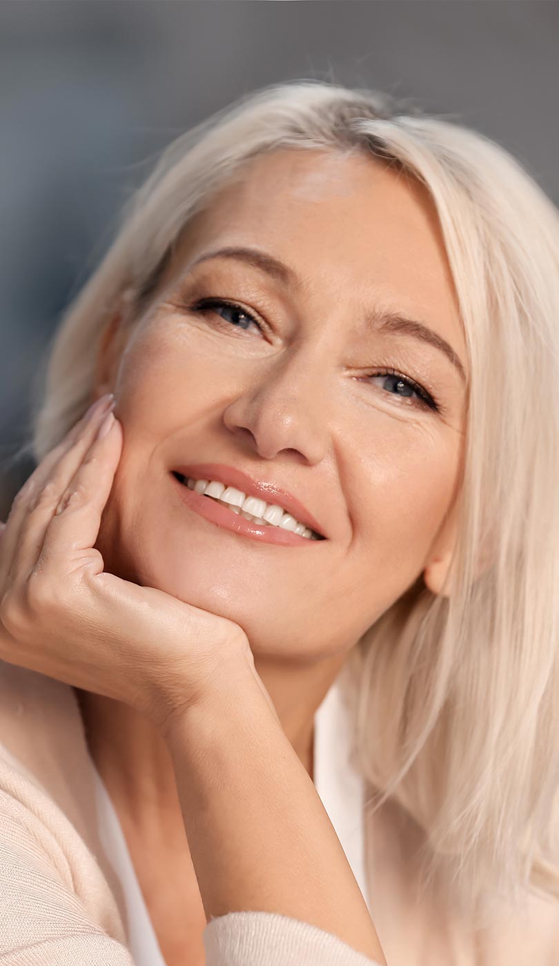 The image shows a modern dental or medical office interior with a dental chair, equipment, and a clean, professional environment.